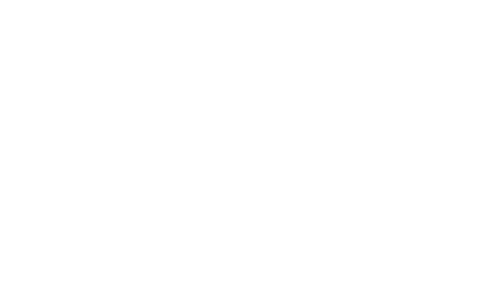 The Thompson River's University logo depicting a shield with a sunrise next to the name.